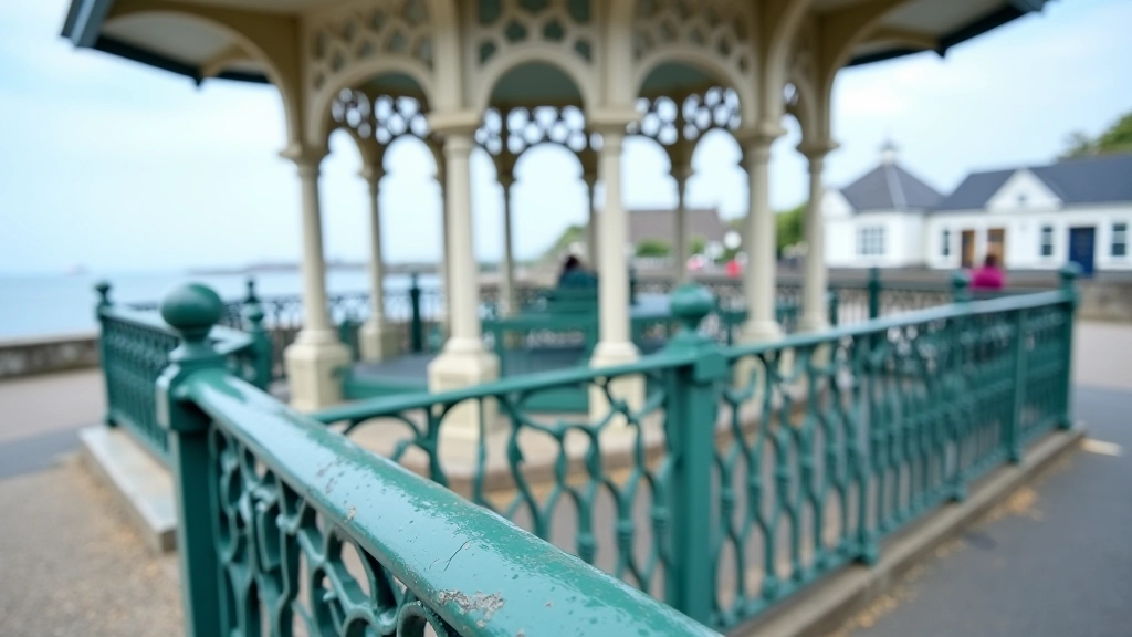 Detailed view of ornate Victorian bandstand iron railings and architectural columns with intricate patterns